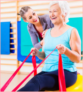 senior woman with stretch band in fitness gym