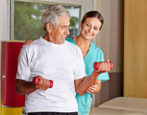caregiver assisting patient to exercise